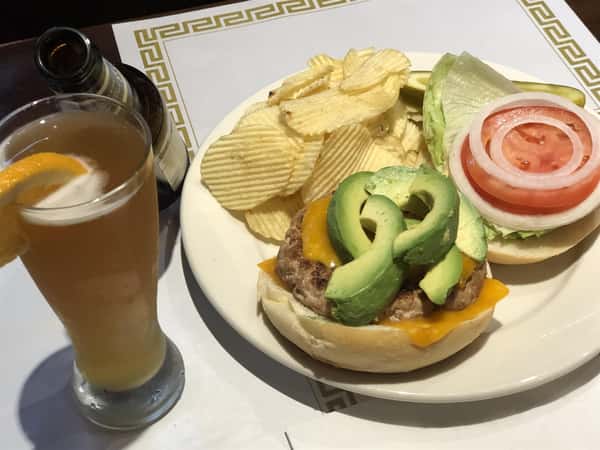 Turkey burger with avocado, tomato, lettuce, onion