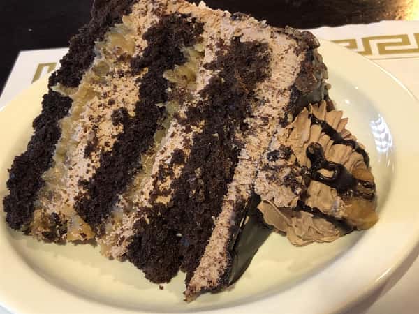 a slice of layered chocolate cake