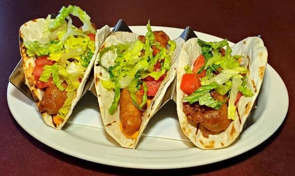 The second image shows crispy fish tacos topped with shredded lettuce, pico de gallo, and fresh herbs, served in soft tortillas for a vibrant handheld favorite.