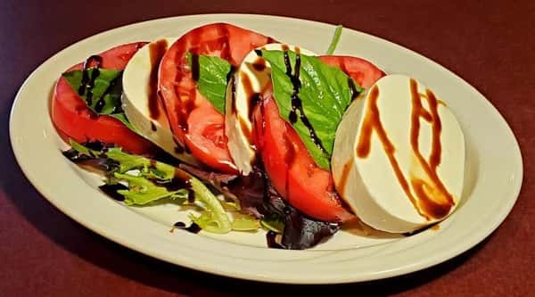 The first image features a fresh caprese-style salad with sliced tomatoes, mozzarella, mixed greens, and balsamic drizzle for a light and colorful presentation.
