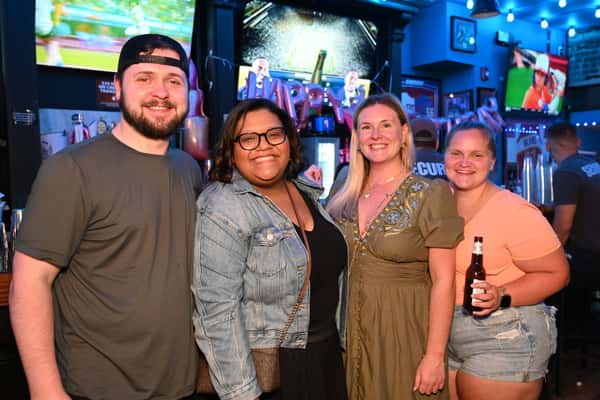 four people at the bar