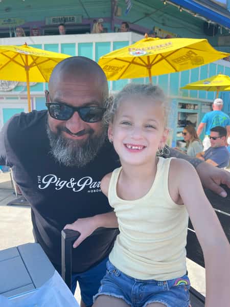 Mike with young customer on patio