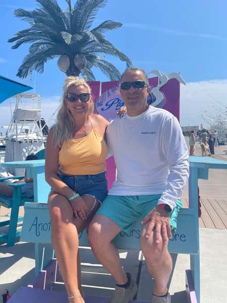 couple on giant Adirondak chair