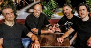 Band sitting at table