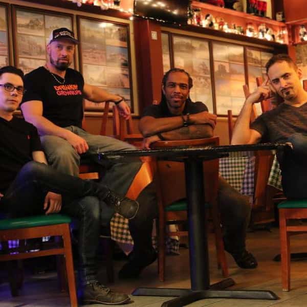 Band sitting at table
