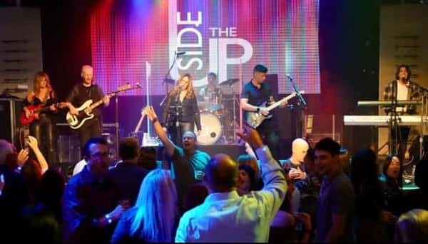 The upside band playing on stage