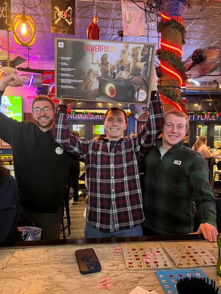 Mike with bingo winners and prizes