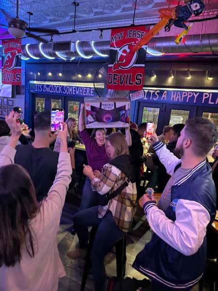Busy bar guests cheering