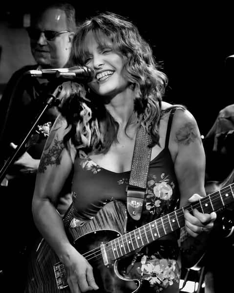 Jenny Barnes playing guitar