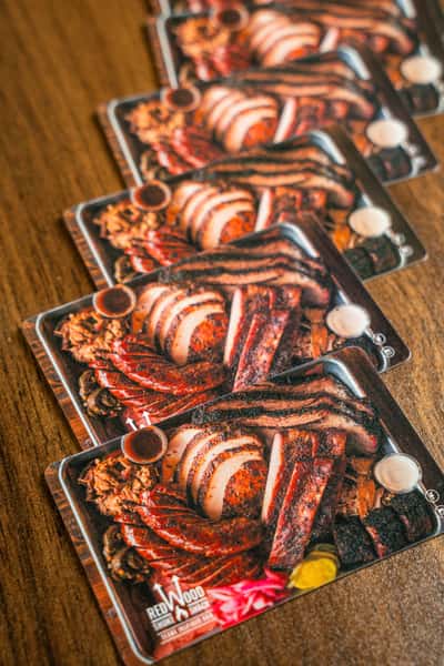 Redwood Smoke Shake gift cards spread out on a table