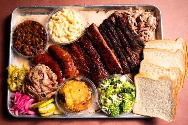BBQ platter with three meats and sides