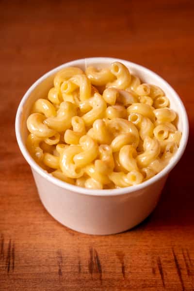 A side cup of macaroni and cheese