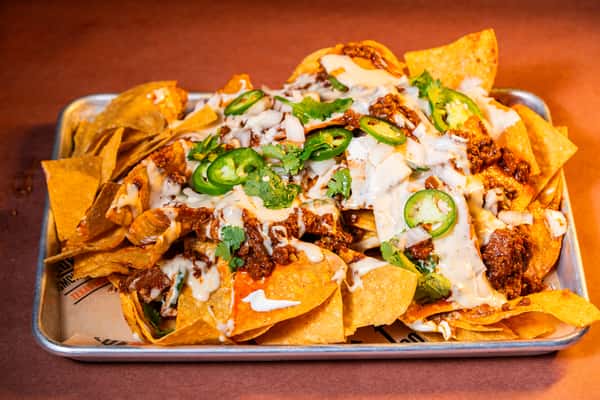 Loaded bbq nachos with queso
