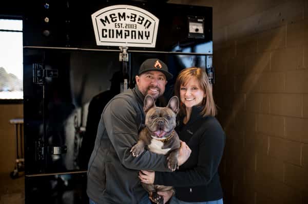 Redwood Smoke Shack owners holding a dog