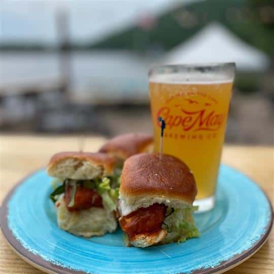 chicken sandwich sliders with glass of beer