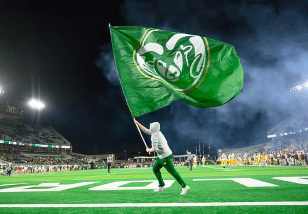 CSU Football Flag being run across the field
