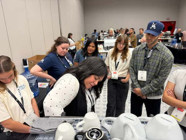 Nicole Rosaly teaches a packed class at SCA Houston on various latte art techniques.