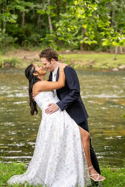 bride and groom river