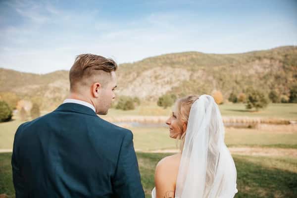 bride and groom behind