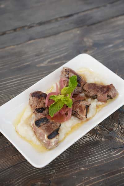 CHARRED LAMB BITES + HERB OIL