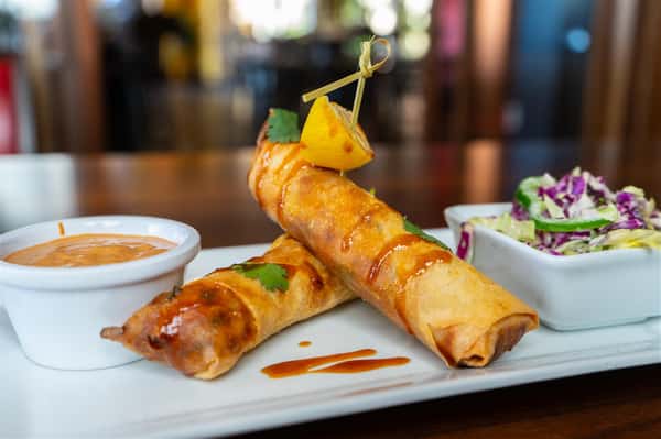 Jambalaya Spring Rolls. Shrimp, andouille sausage, pimento cheese, house dirty rice, vegetable trinity & okra in a crispy spring roll served with our house Voodoo sauce