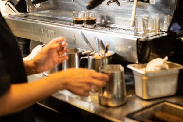 Barista at espresso machine