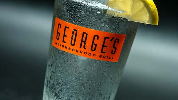 George's Neighboorhood Grill cup with a lemon wedge on the side