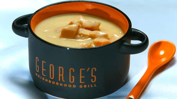 George's grill coffee cup filled with soup
