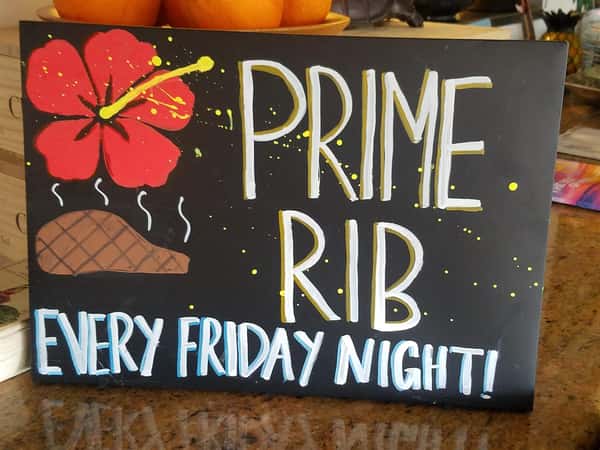 sign that reads, "prime rib every Friday night"