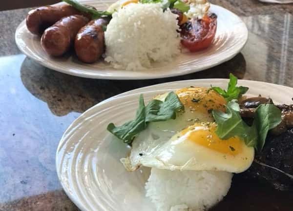 fried eggs with rice and sausage with rice