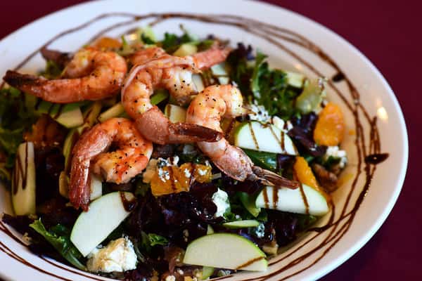 Shrimp over salad