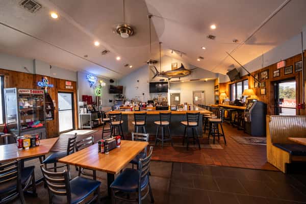 Warm lit square bar and table dining
