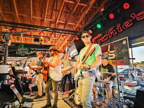 Julio Saltines performing at Captain Archie's on the outdoor waterfront stage