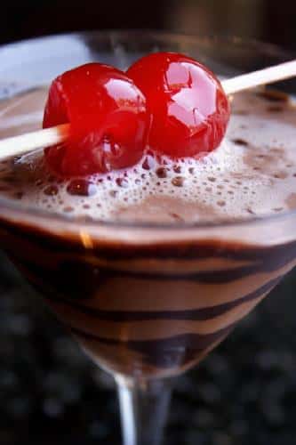 chocolate drink in a martini glass with cherries