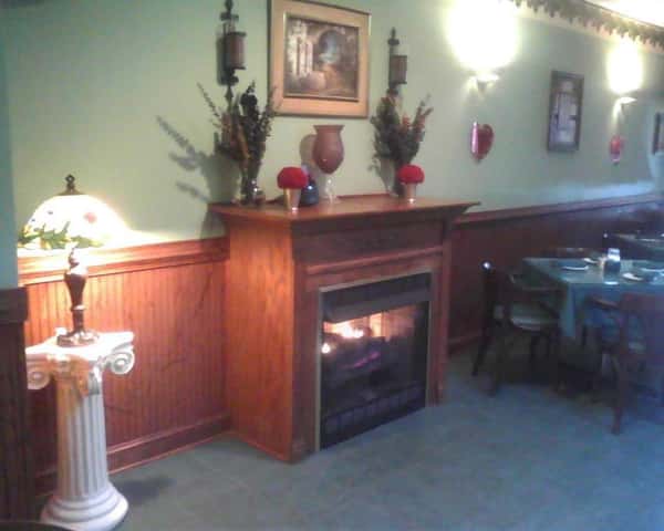 interior dining area with a fireplace