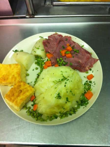 corned beef and cabbage with a side of corn bread