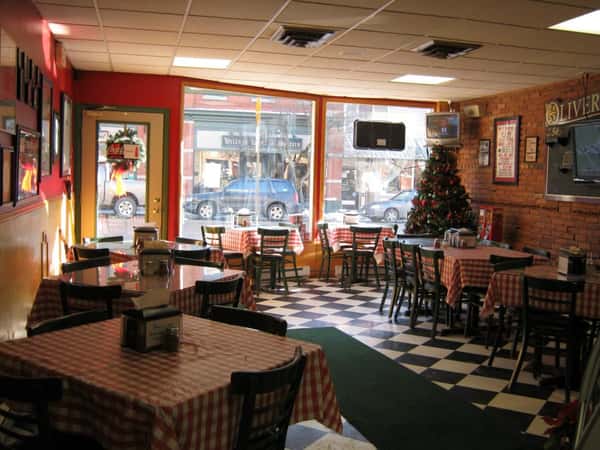 interior dining area for oliveri's pizzeria with tables and chairs