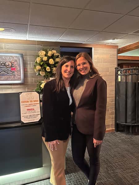 two ladies by front desk