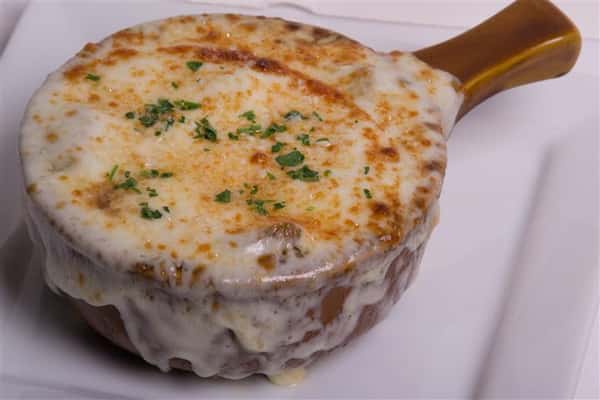 french onion soup covered in mozzarella cheese