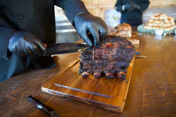 Cutting bbq ribs on a cutting board