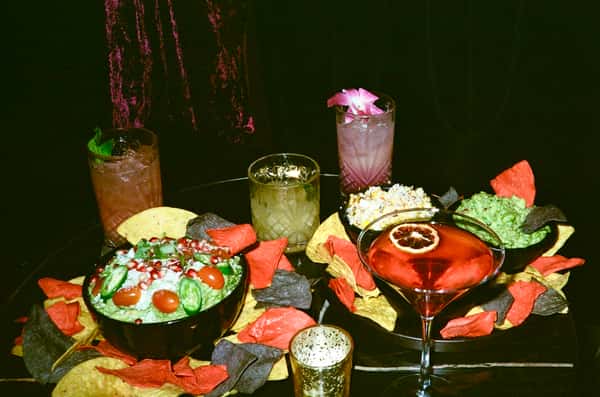 Table filled with apps and drinks