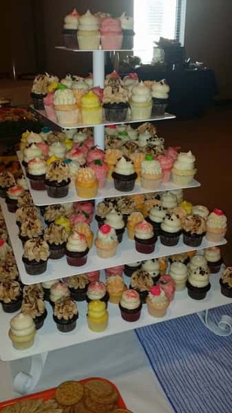 Multi-tier display with a selection of mini cupcakes