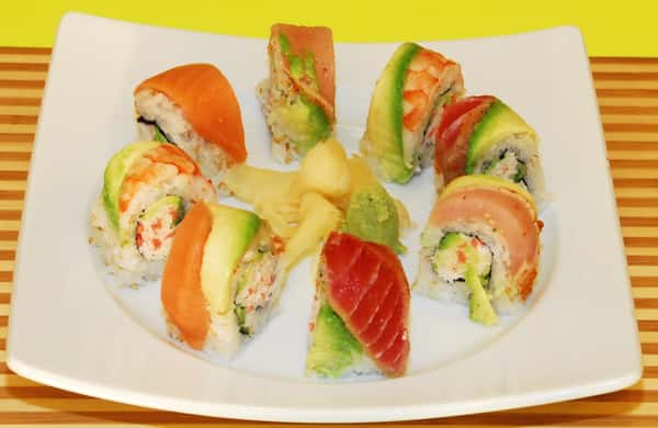 Rainbow sushi roll with assorted fish and avocado slices