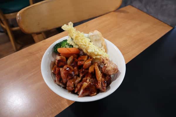 Bowl with rice, teriyaki chicken, and tempura vegetables.