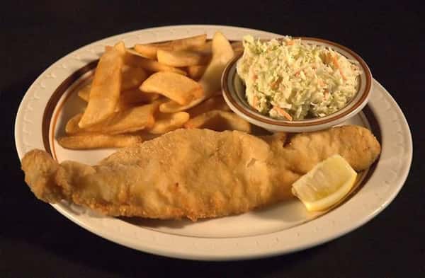 Fried Walleye fillet with a lemon wedge served with fries and a side of cole slaw
