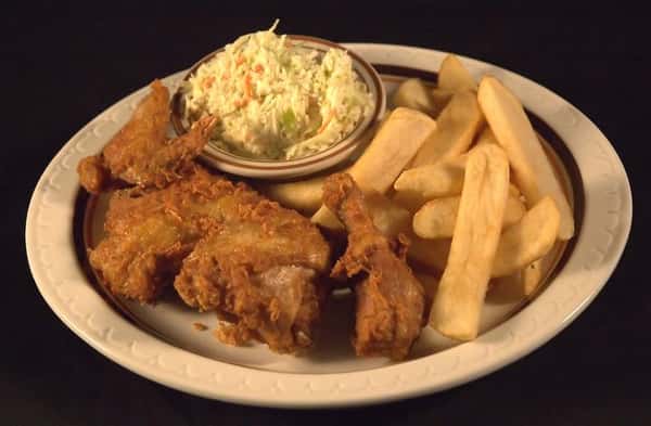 Chicken dinner served with fries and a side of cole slaw