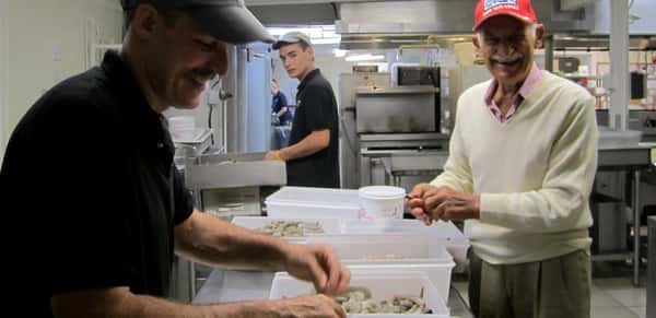 The original Seafood Sam (right), doing prep work with Jeff, co-owner of our Sandwich restaurant