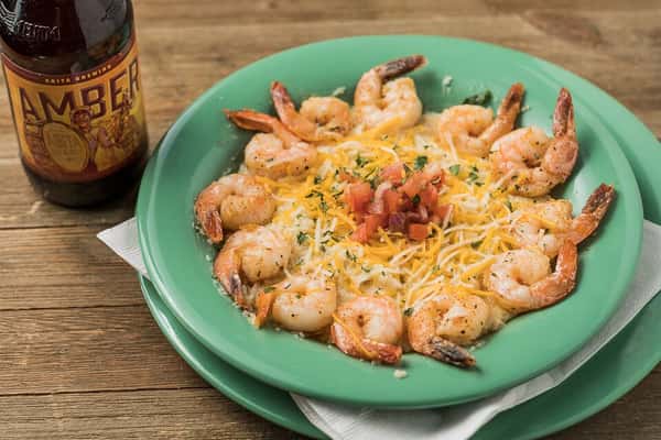 Bowl of grilled shrimp and shredded cheese