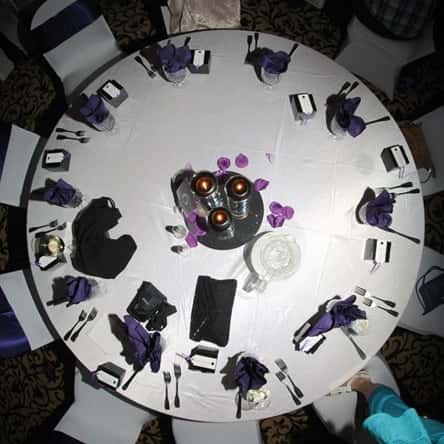 Ariel shot of Wedding table set up with glass wear and dish wear