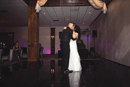 Married couple slow dancing on dance floor